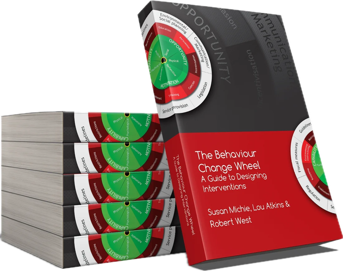 The Behaviour Change Wheel book, with a stack of copies